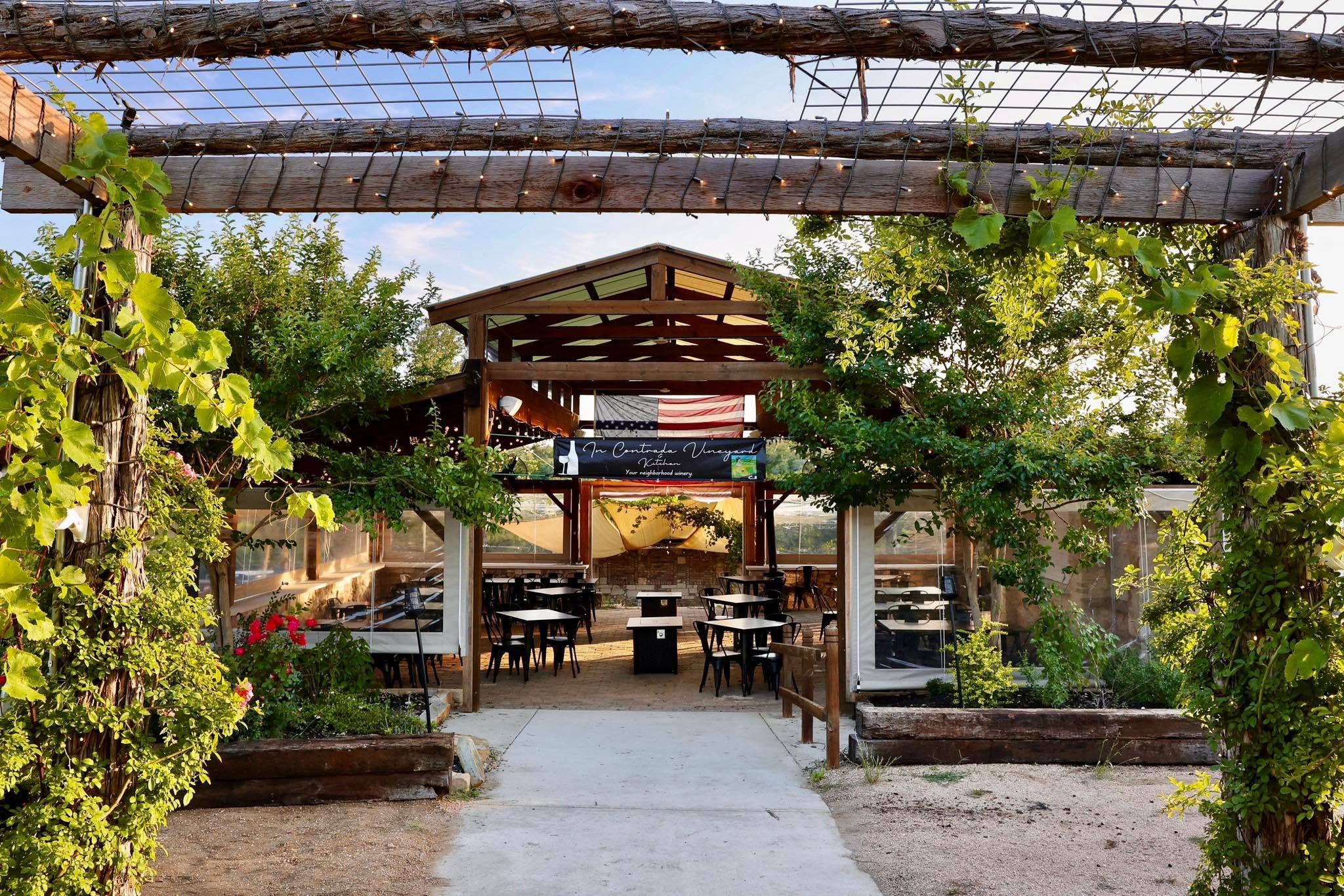 Vine-covered entrance to In Contrada Vineyard & Kitchen near San Antonio